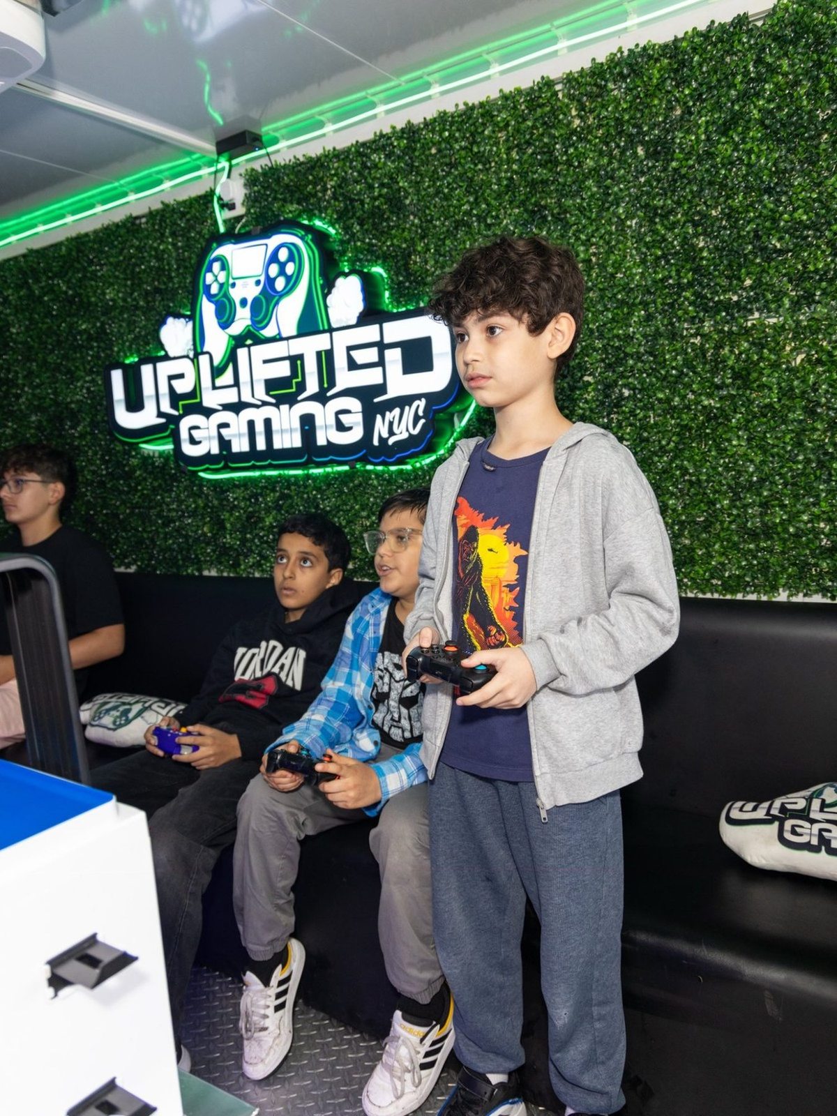 Mobile gaming truck interior with PS5 and Xbox setups