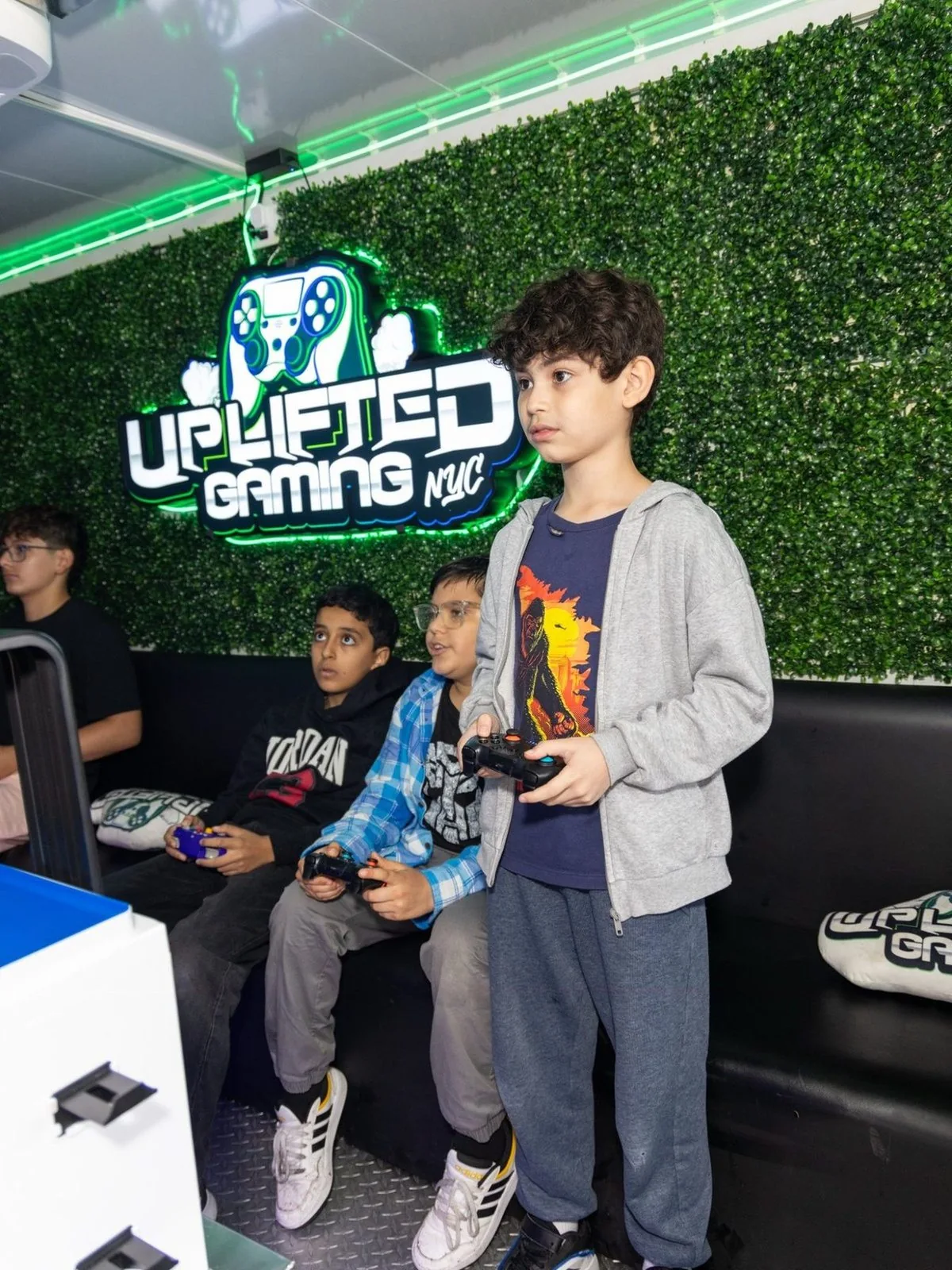 Mobile gaming truck interior with PS5 and Xbox setups
