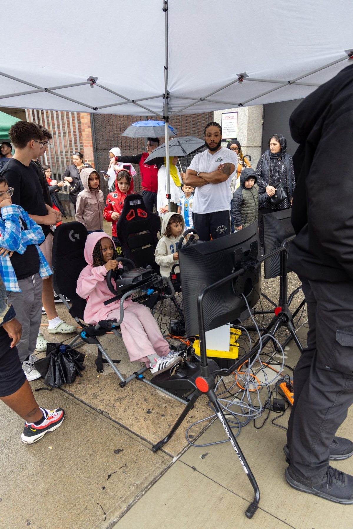 Corporate team building NYC racing simulator gaming truck event crowd