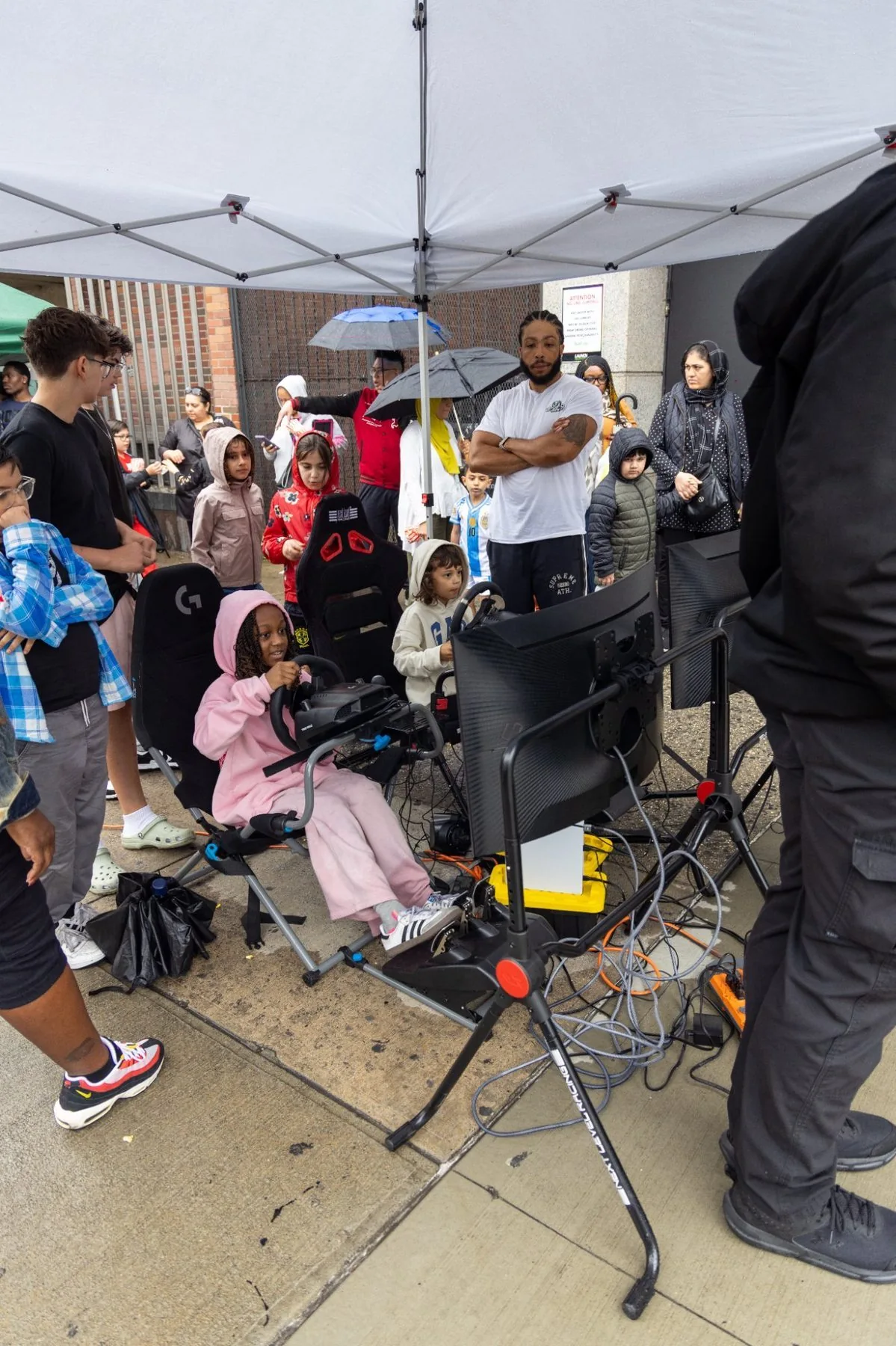 Racing simulator crowd at gaming truck NYC event