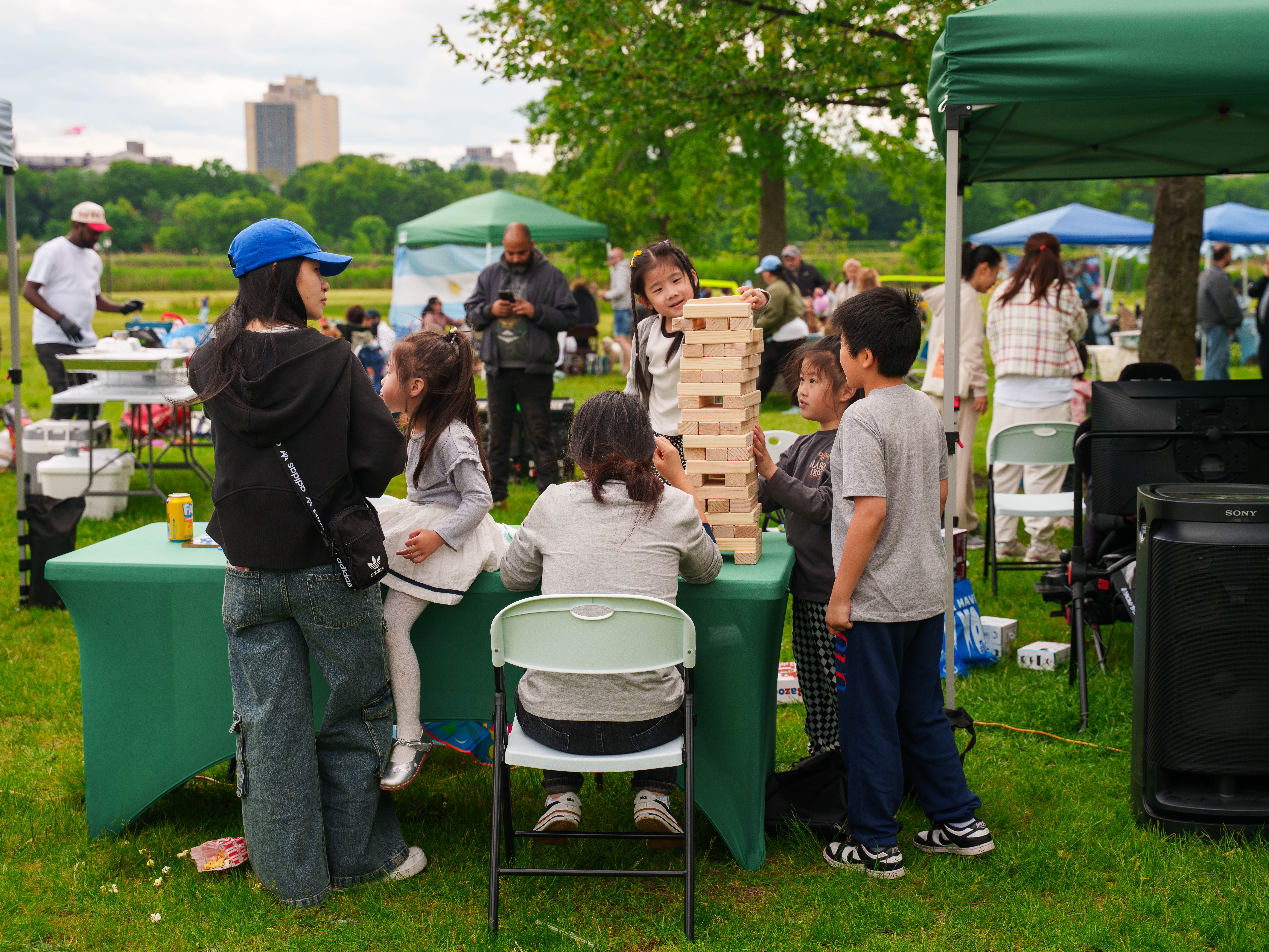 Kids playing giant Jenga at a community event